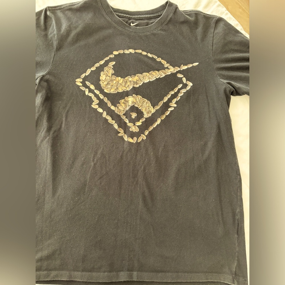 Nike T-shirt. Size medium. Dry fit. Design is made of sunflower seeds.